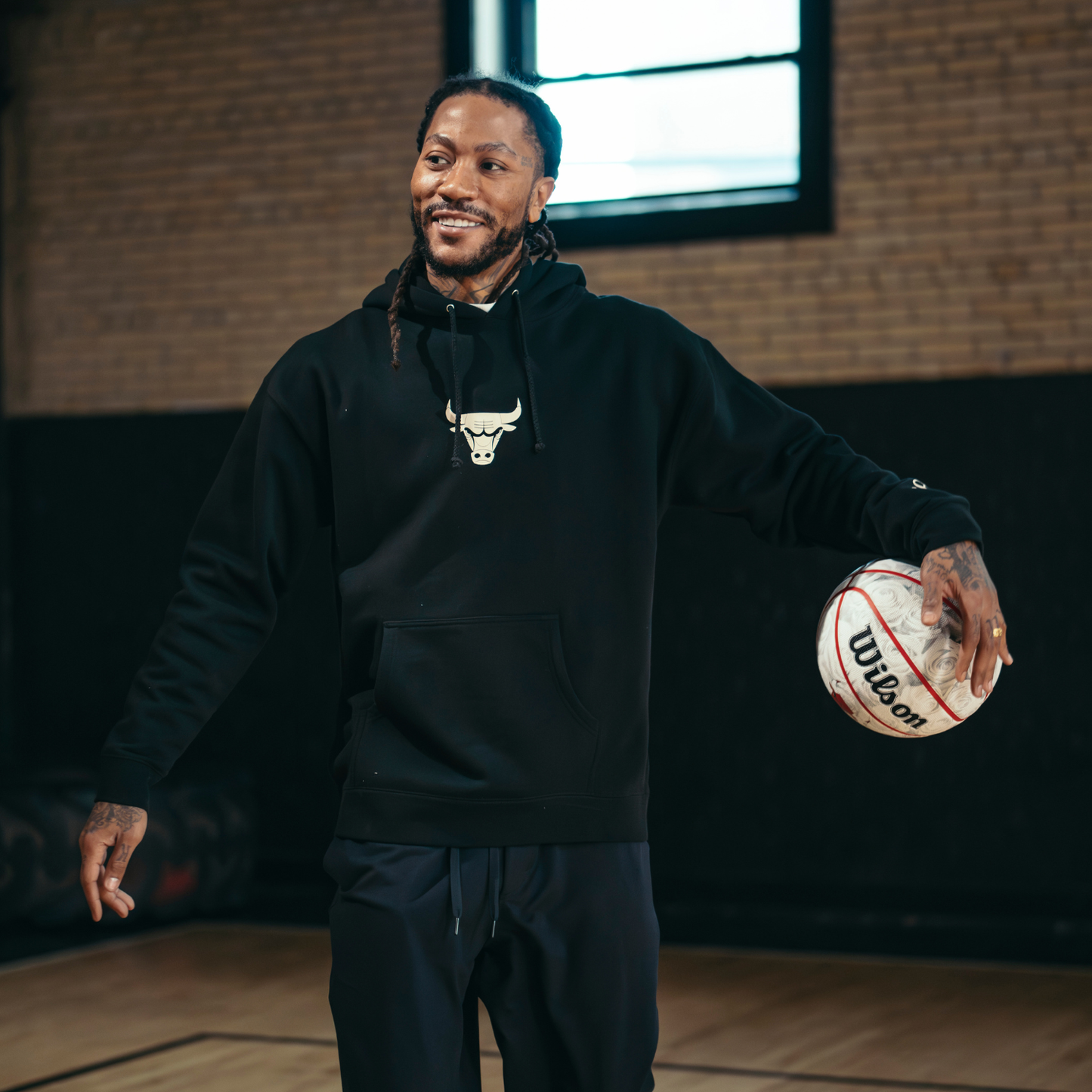 Rose holding a basketball in an indoor setting