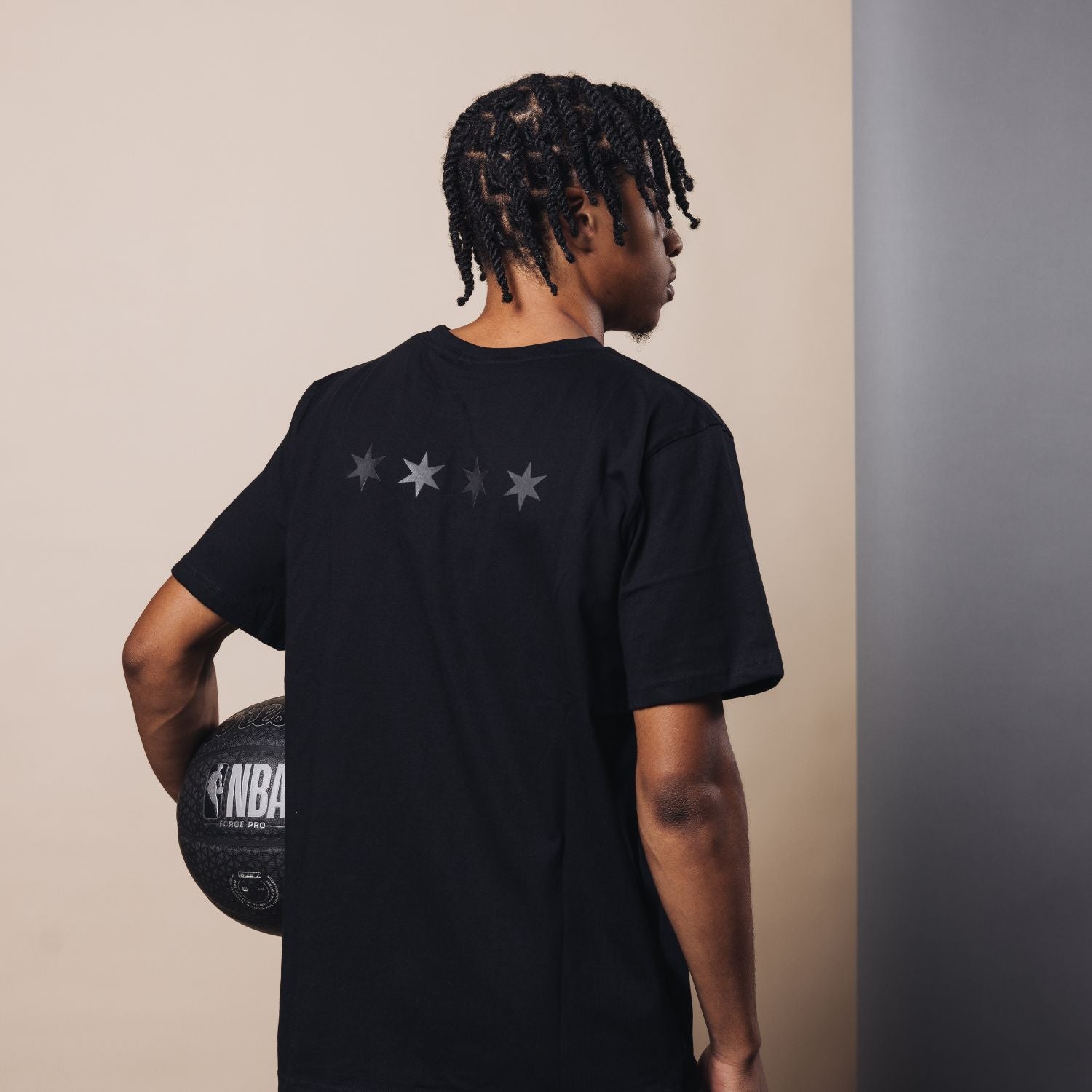 Model Wearing 2025-26 City Edition Chicago Bulls 1966 Black Out T-Shirt