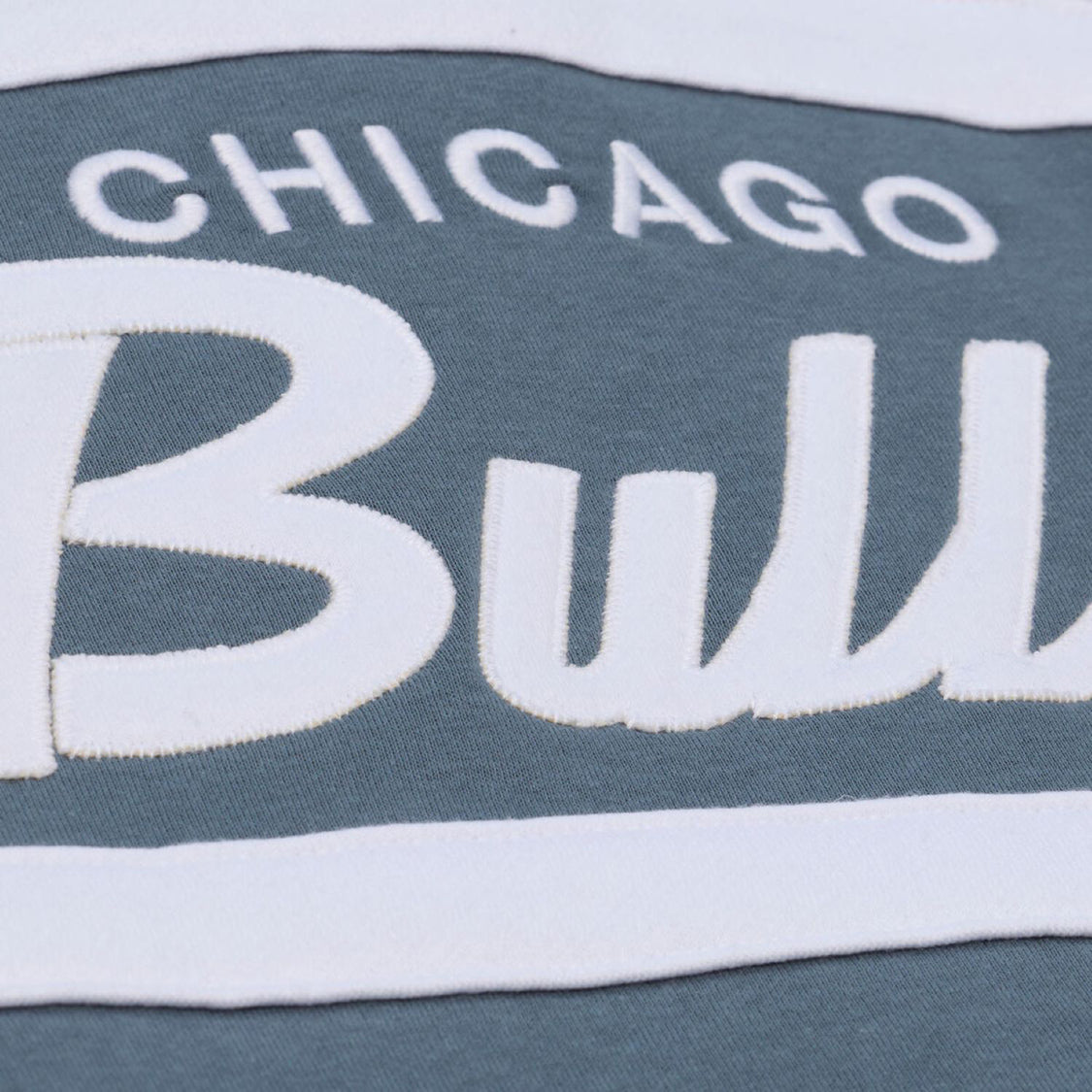 Chicago Bulls Mitchell & Ness Thunderstorm Head Coach Quarter Zip in Blue and Cream - Front Detail View